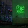 Break the Rules neon sign in deep green for rebellious decor, creative studios, and bold interiors.
