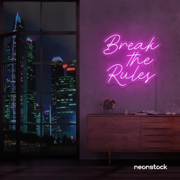 Break the Rules neon sign in pink for rebellious decor, creative studios, and bold interiors.