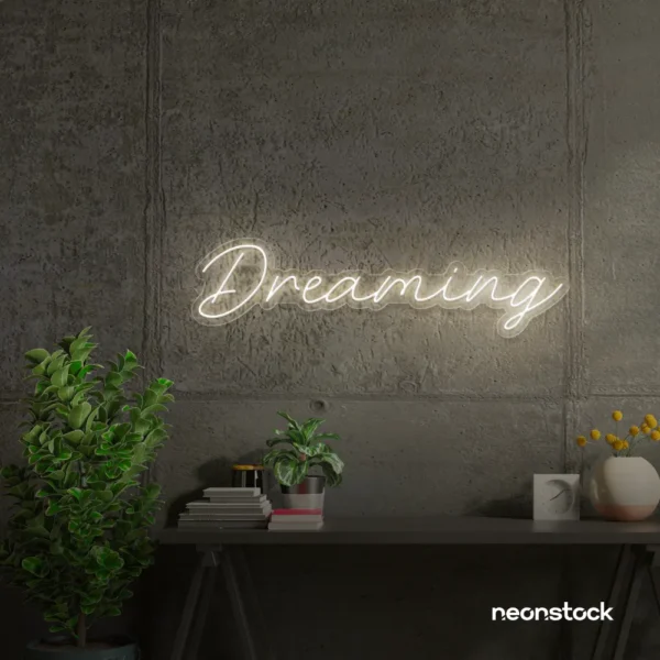 Dreaming neon sign in neutral white for dreamy decor, teen bedrooms, and relaxing nooks.