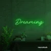 Dreaming neon sign in deep green for dreamy decor, teen bedrooms, and relaxing nooks.