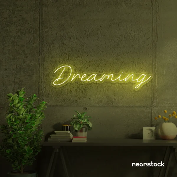 Dreaming neon sign in lemon yellow for dreamy decor, teen bedrooms, and relaxing nooks.