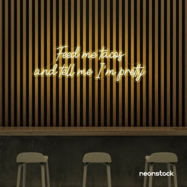 Feed Me Tacos neon sign in warm white for taco kitchens, Mexican restaurants, and quirky wall art.