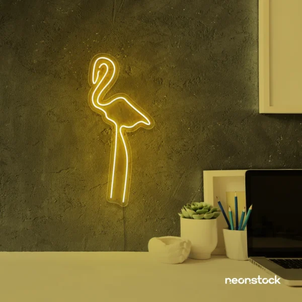 Flamingo neon sign in golden yellow for kids room or tropical-themed decor