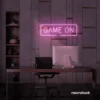 Game On neon sign in baby pink for gaming setups, man caves, and kids' rooms.