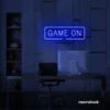 Game On neon sign in dark blue for gaming setups, man caves, and kids' rooms.