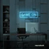 Game On neon sign in ice blue for gaming setups, man caves, and kids' rooms.