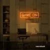 Game On neon sign in orange for gaming setups, man caves, and kids' rooms.