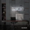 Game On neon sign in white for gaming setups, man caves, and kids' rooms.