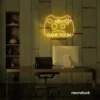 Gaming controller neon sign in golden yellow for game rooms, stream setups, and kids' walls.