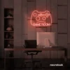Gaming controller neon sign in peachy pink for game rooms, stream setups, and kids' walls.