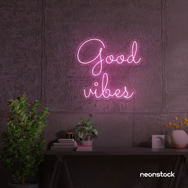 Good Vibes neon sign in baby pink for positive room decor, dorm walls, and relaxing interiors.