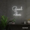 Good Vibes neon sign in white for positive room decor, dorm walls, and relaxing interiors.