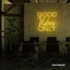 Good Vibes Only neon sign in golden yellow for home, bar, or garage wall decor.