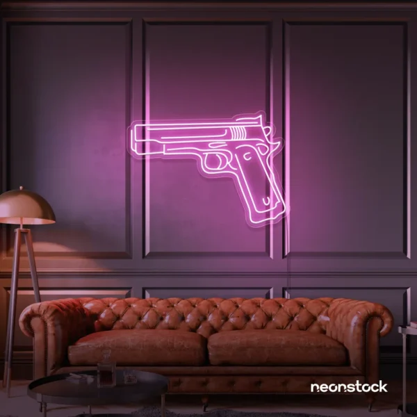 Gun neon sign in baby pink – edgy LED wall decor for modern spaces and game rooms.