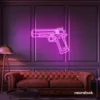 Gun neon sign in pink – edgy LED wall decor for modern spaces and game rooms.