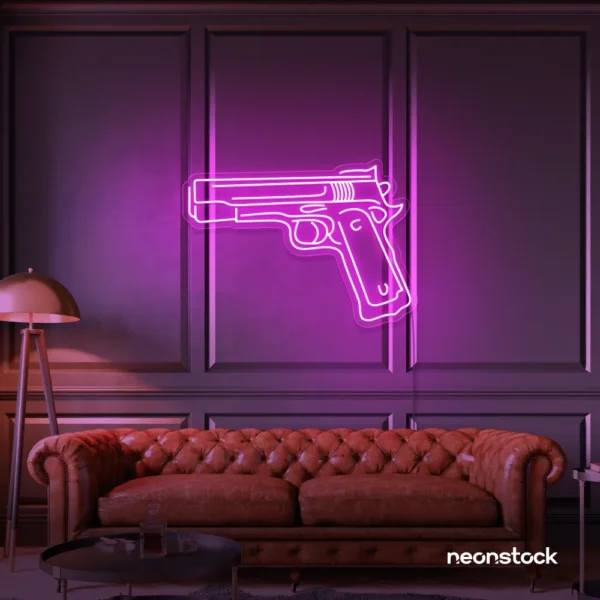 Gun neon sign in pink – edgy LED wall decor for modern spaces and game rooms.