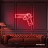 Gun neon sign in red – edgy LED wall decor for modern spaces and game rooms.