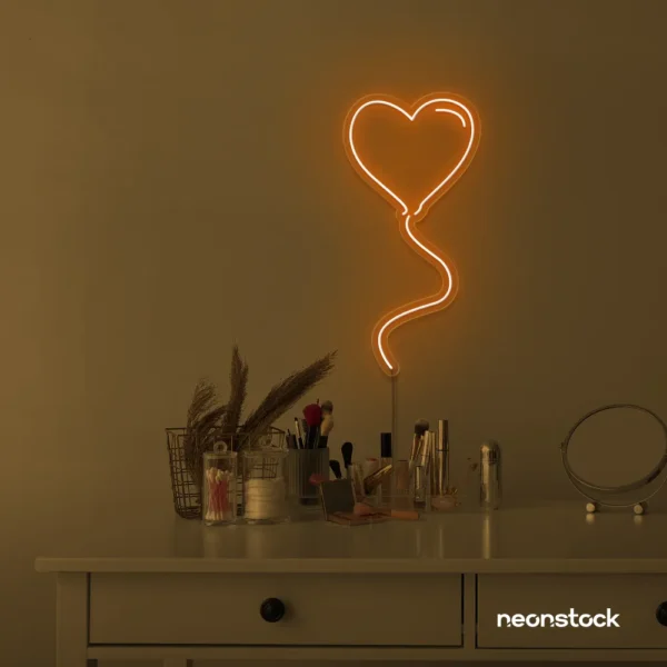 Heart balloon neon sign in orange for kids' rooms, Valentine's Day decor, and romantic wall styling.