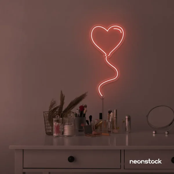 Heart balloon neon sign in peachy pink for kids' rooms, Valentine's Day decor, and romantic wall styling.