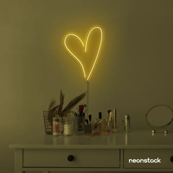 Heart neon sign in golden yellow for beauty salons, home decor, dorm rooms, and Valentine's Day themes.
