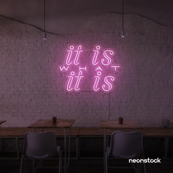 It Is What It Is neon sign in baby pink for calm decor, chill rooms, and positive interiors.