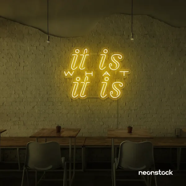It Is What It Is neon sign in golden yellow for calm decor, chill rooms, and positive interiors.