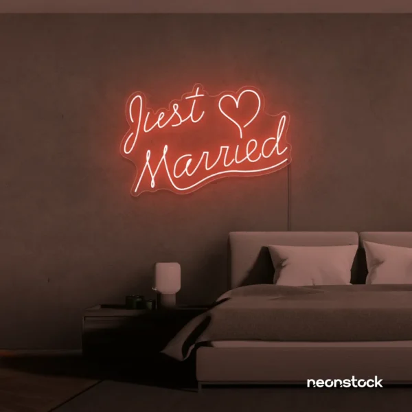 Just Married neon sign in peachy pink for wedding decor, bridal shower, reception backdrop