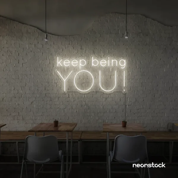 Keep Being You neon sign in neutral white for empowerment decor, teen rooms, and creative wall spaces.