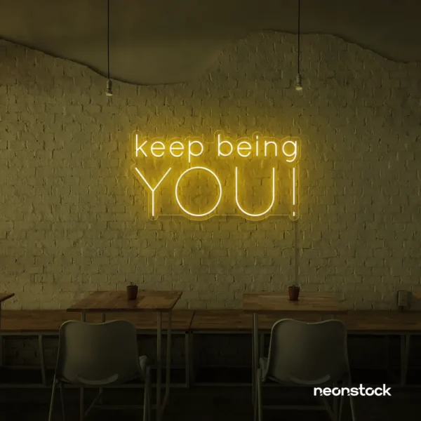 Keep Being You neon sign in golden yellow for empowerment decor, teen rooms, and creative wall spaces.