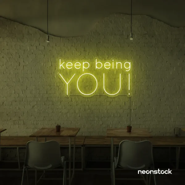 Keep Being You neon sign in lemon yellow for empowerment decor, teen rooms, and creative wall spaces.