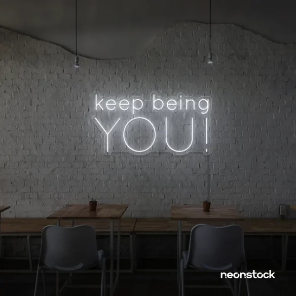 Keep Being You neon sign in white for empowerment decor, teen rooms, and creative wall spaces.