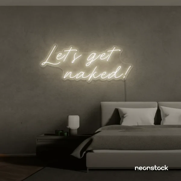 Let's Get Naked neon sign in neutral white for bathroom decor, cheeky bedrooms, and romantic lighting.