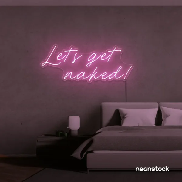 Let's Get Naked neon sign in baby pink for bathroom decor, cheeky bedrooms, and romantic lighting.