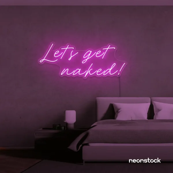 Let's Get Naked neon sign in pink for bathroom decor, cheeky bedrooms, and romantic lighting.