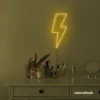 Lightning bolt neon sign in golden yellow for modern wall decor