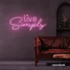 Live Simply neon sign in baby pink for minimalist decor, peaceful homes, and calming interiors.