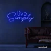Live Simply neon sign in dark blue for minimalist decor, peaceful homes, and calming interiors.