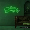 Live Simply neon sign in deep green for minimalist decor, peaceful homes, and calming interiors.