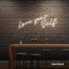 Love Yourself neon sign in neutral white for self-love decor, beauty rooms, and empowering spaces.