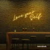 Love Yourself neon sign in golden yellow for self-love decor, beauty rooms, and empowering spaces.