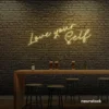 Love Yourself neon sign in warm white for self-love decor, beauty rooms, and empowering spaces.
