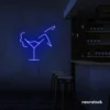 Martini girl neon sign in dark blue for stylish night bar or lounge walls.