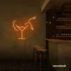 Martini girl neon sign in orange for energetic, lively bar themes.