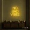 No Bad Vibes neon sign in golden yellow for dorm walls, man caves, and modern mood-boosting decor.