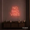 No Bad Vibes neon sign in peachy pink for dorm walls, man caves, and modern mood-boosting decor.