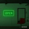 Open neon sign in deep green for storefronts, salons, restaurants, and retail displays.