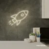 Rocket neon sign in neutral white for kids' rooms, play areas, and space-themed nursery decor.