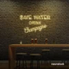 Save Water Drink Champagne neon sign in warm white for party kitchens, wine bars, and bubbly wall decor.