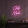 Self Made neon sign in baby pink for home offices, studios, and entrepreneur decor.