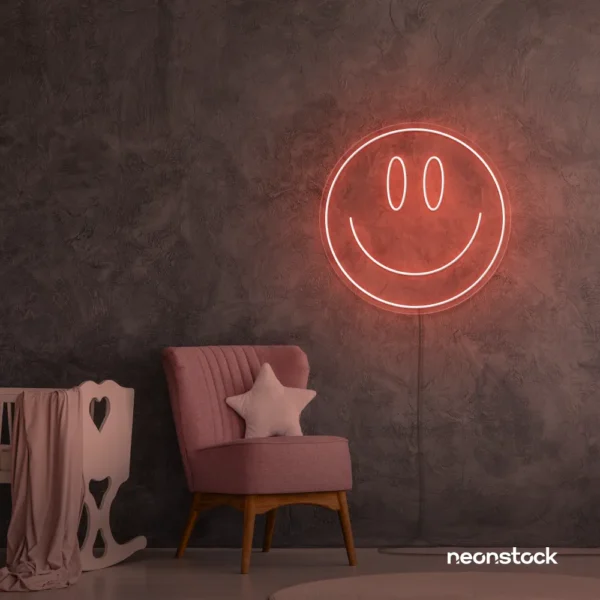 Smiley face neon sign in peachy pink for dorm walls, teen rooms, and joyful room decor.